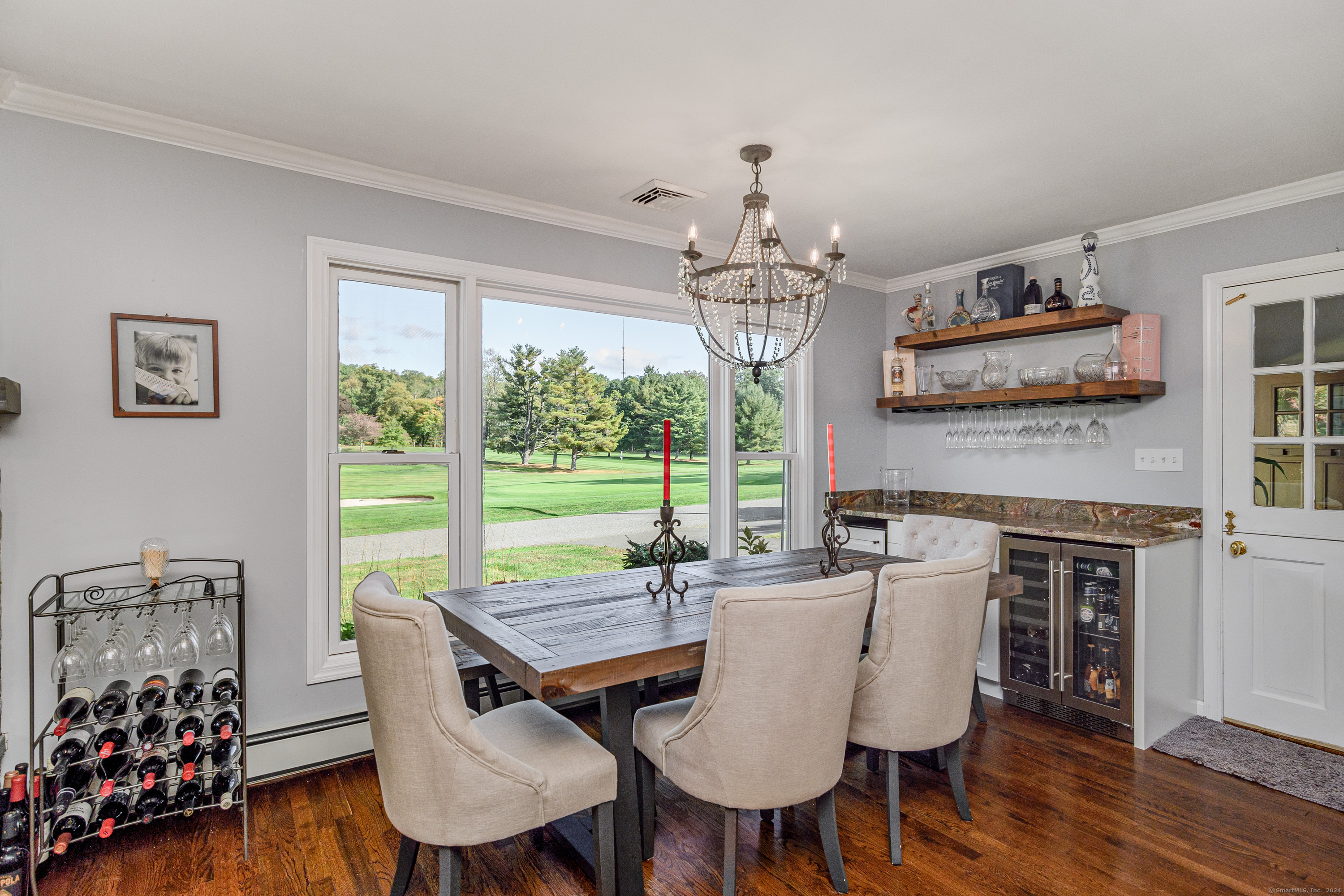 22 Brookside Trail New Milford, CT 06776 - Photo 11 of 40 a view of a dining room with furniture window and wooden floor