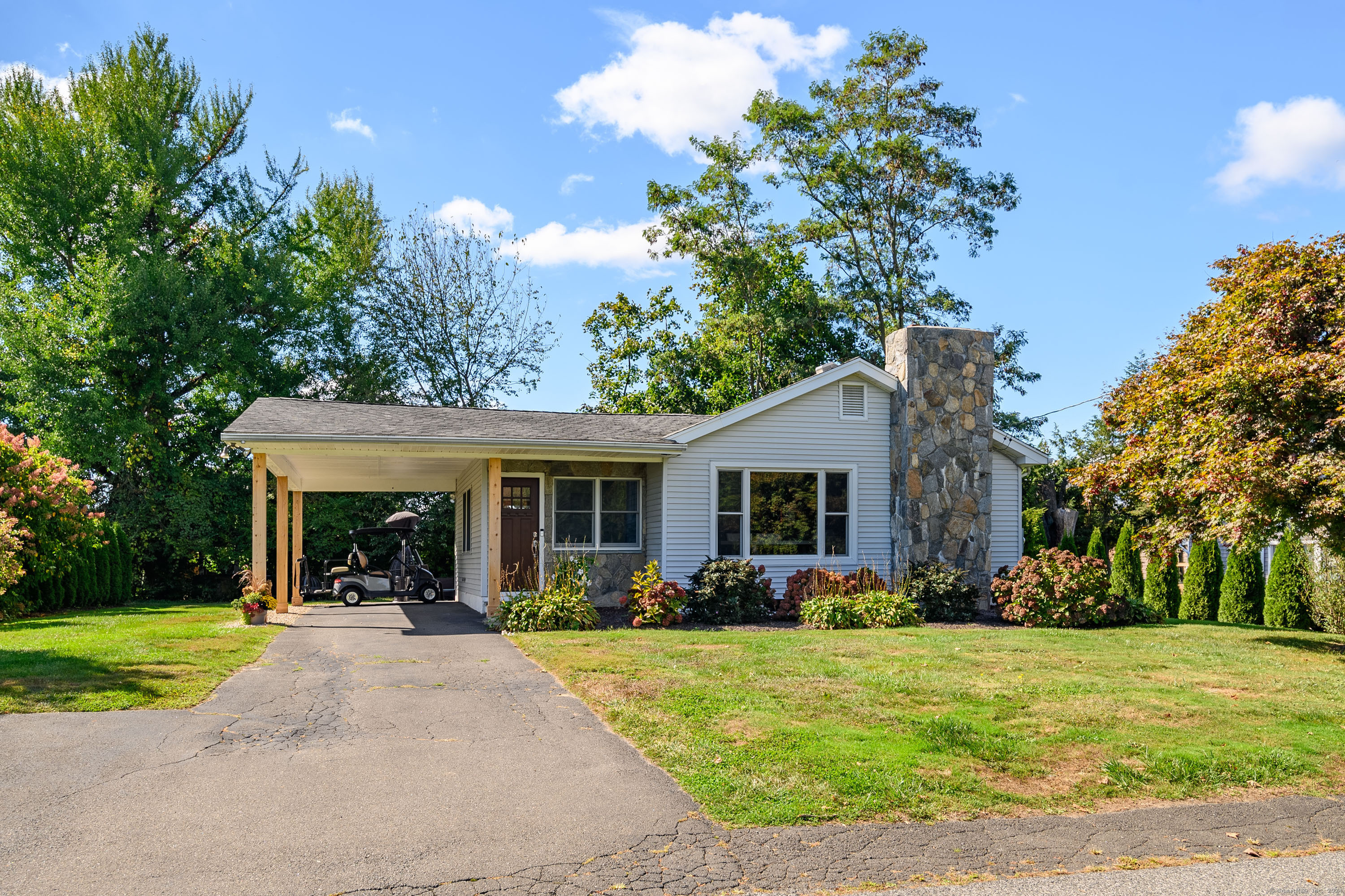 22 Brookside Trail New Milford, CT 06776 - Photo 2 of 40 a front view of house with yard and green space