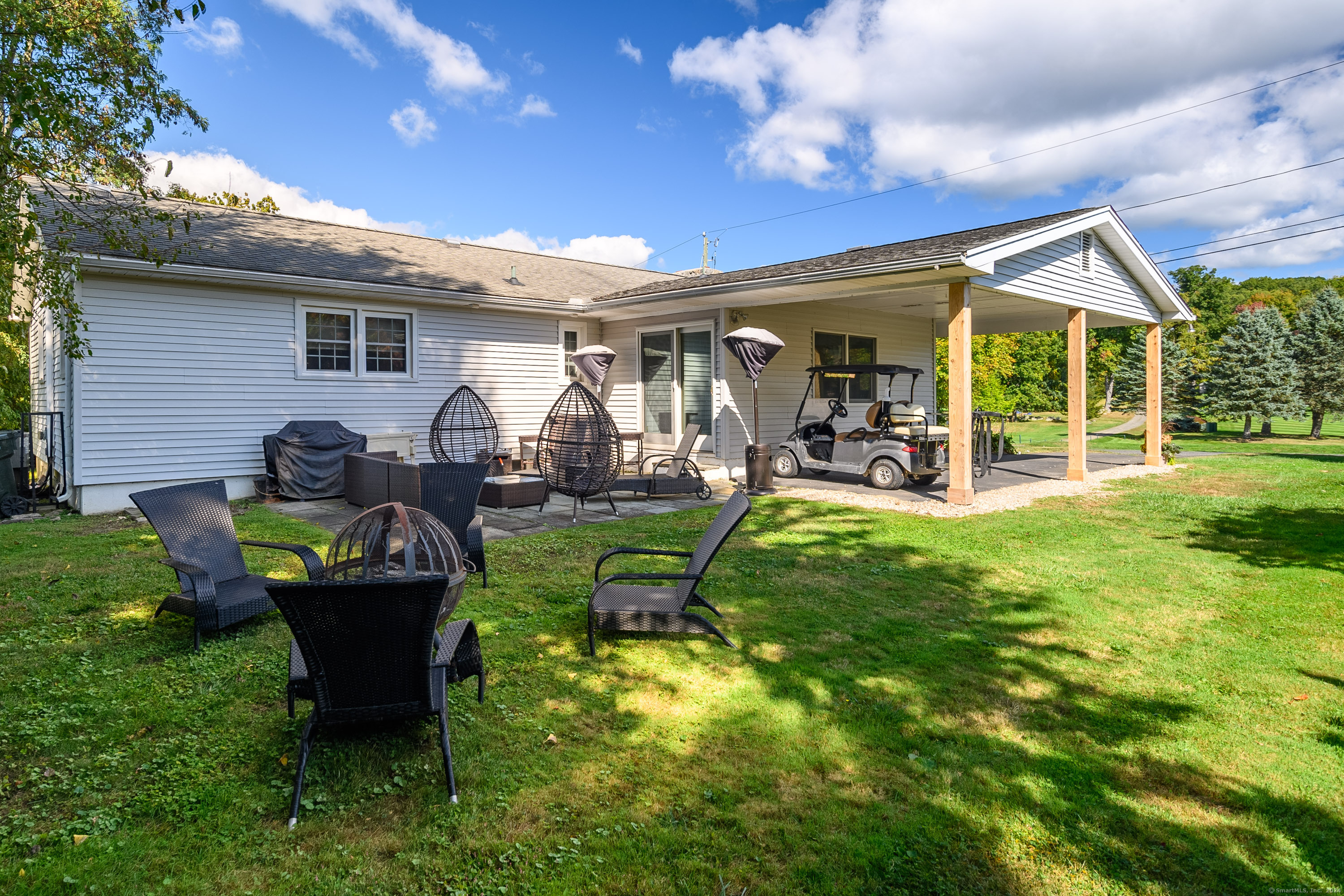 22 Brookside Trail New Milford, CT 06776 - Photo 23 of 40 a front view of a house with garden and sitting area