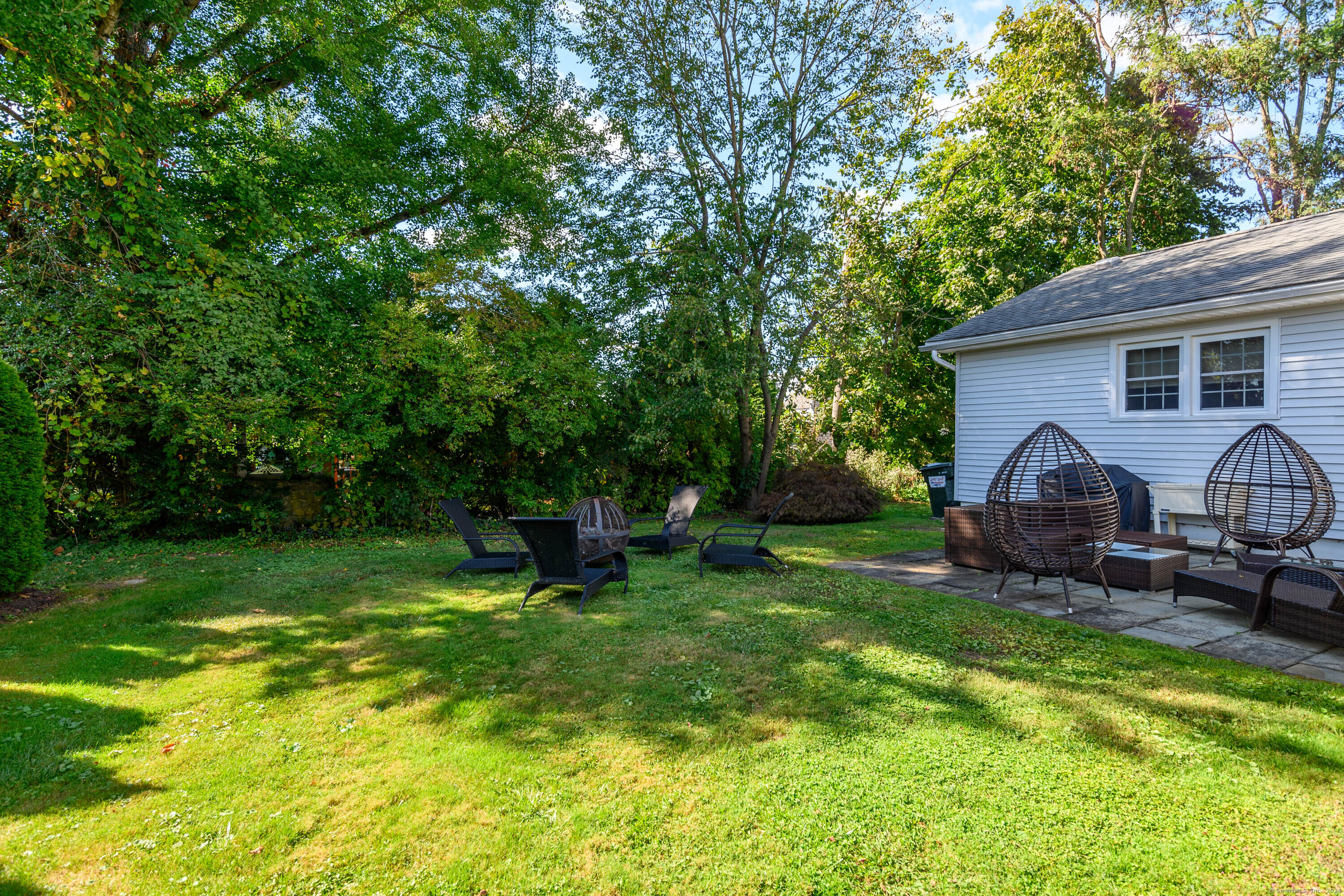 22 Brookside Trail New Milford, CT 06776 - Photo 26 of 40 a view of a house with backyard and sitting area