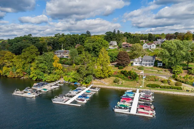 an aerial view of residential houses with yard