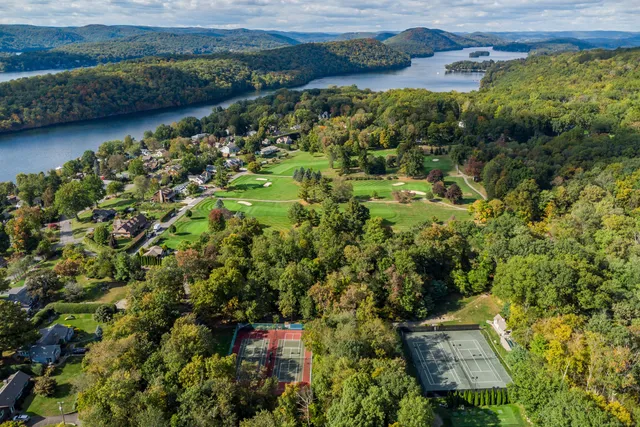 an aerial view of a house with a yard