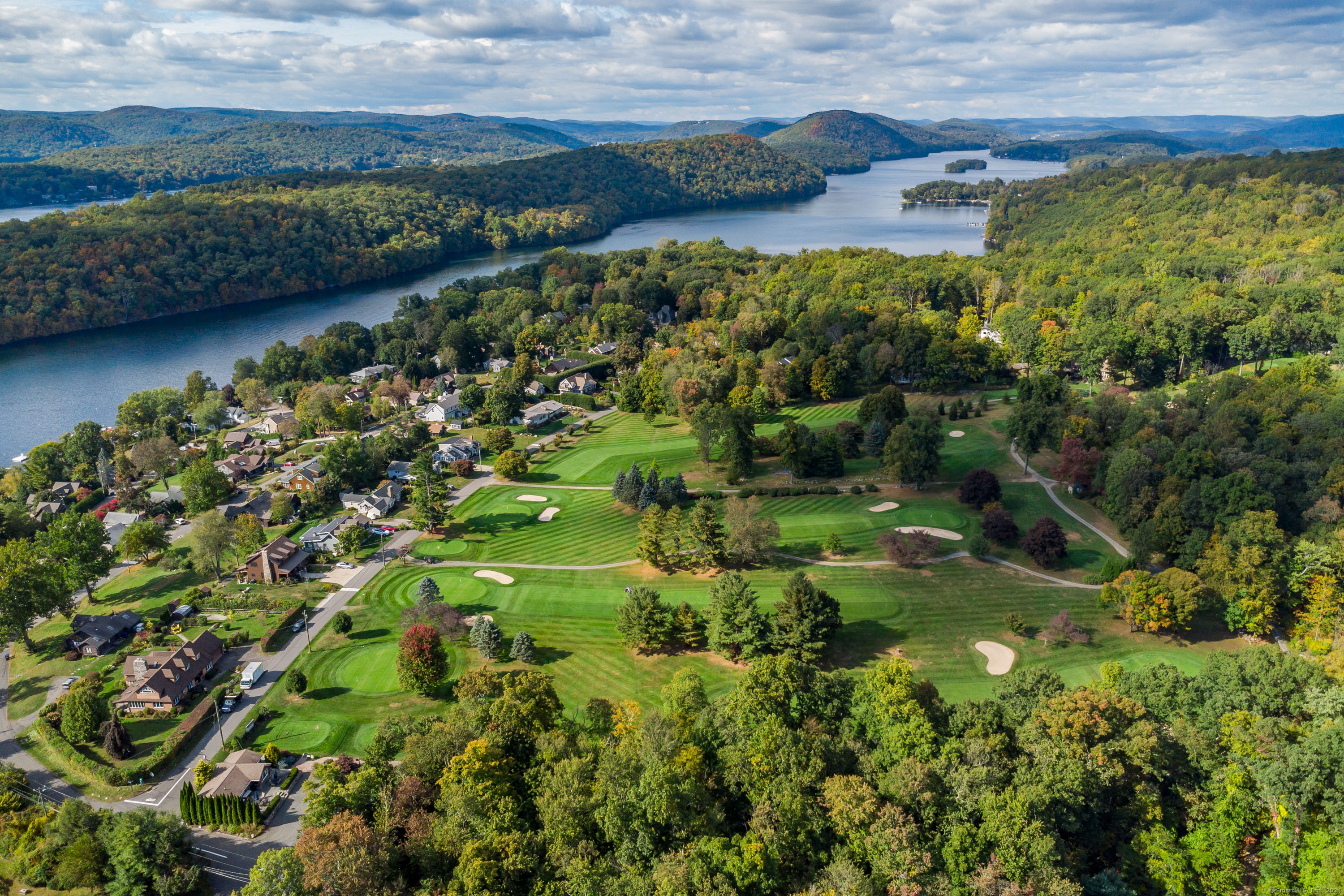 22 Brookside Trail New Milford, CT 06776 - Photo 37 of 40 a view of a lake with a city