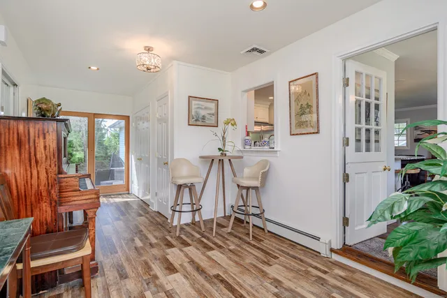a view of a livingroom with furniture and wooden floor