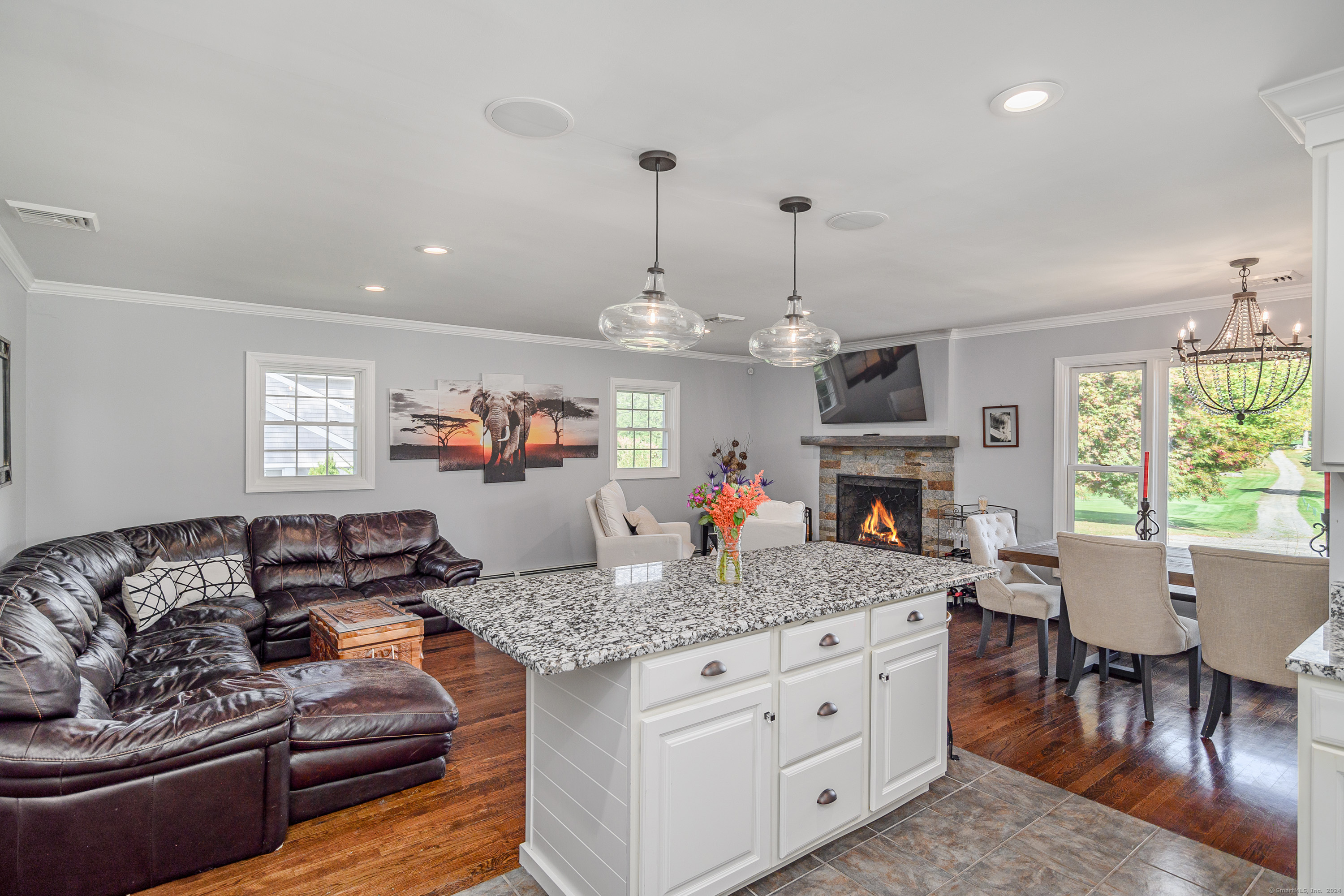 22 Brookside Trail New Milford, CT 06776 - Photo 10 of 40 a living room with fireplace furniture and a chandelier