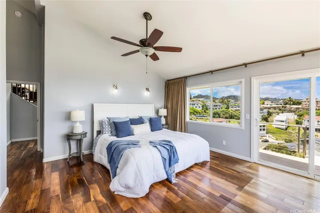 a bedroom with a large bed and a large window