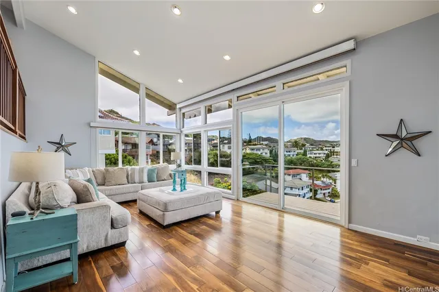 a living room with furniture and a large window