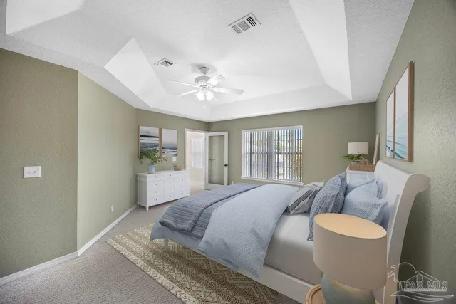 a bedroom with furniture and a chandelier