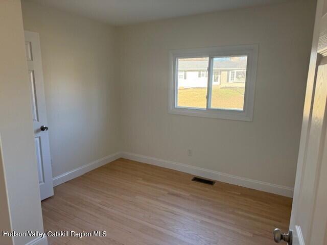 16 Trinity Place Rhinebeck, NY 12572 - Photo 32 of 42 an empty room with wooden floor and windows