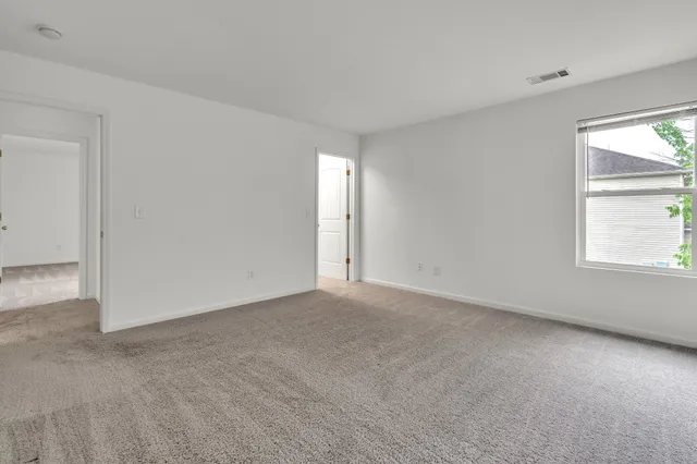 an empty room with windows