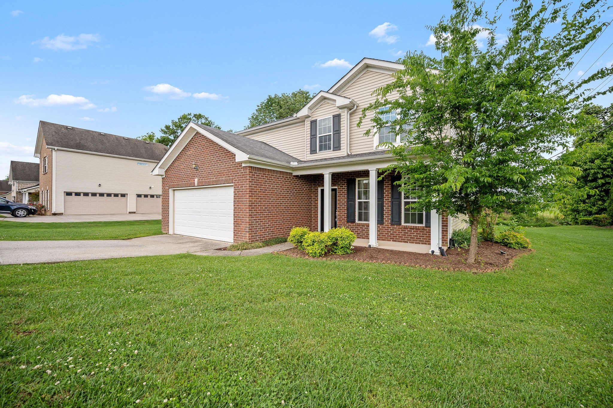 1000 Beverly Lane Spring Hill, TN 37174 - Photo 42 of 54 a front view of a house with a yard and porch