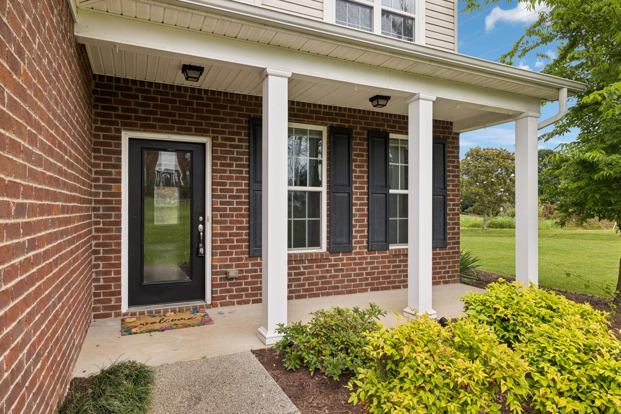 1000 Beverly Lane Spring Hill, TN 37174 - Photo 5 of 54 a front view of a house with a yard