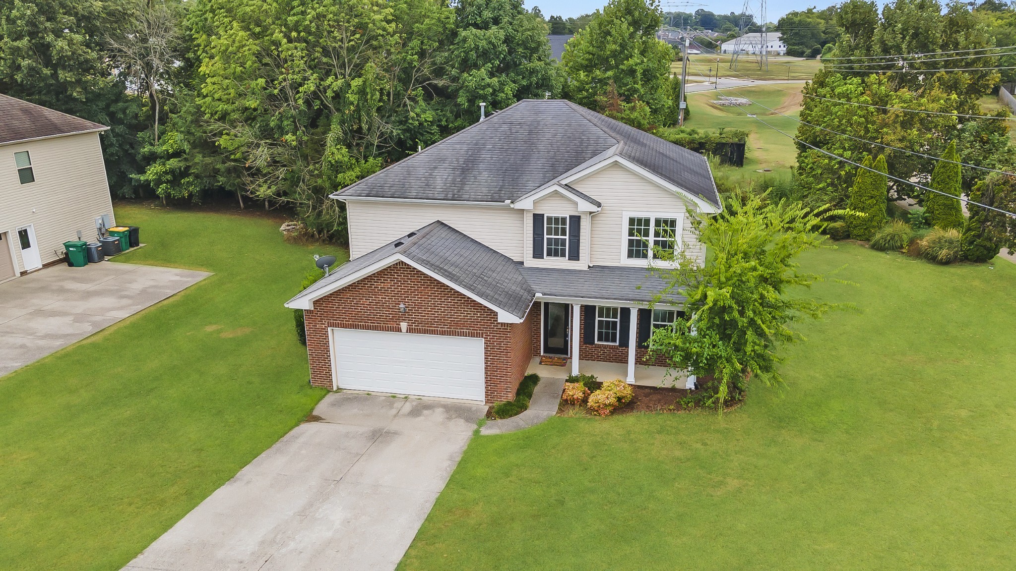 1000 Beverly Lane Spring Hill, TN 37174 - Photo 52 of 54 a aerial view of a house next to a big yard and large trees