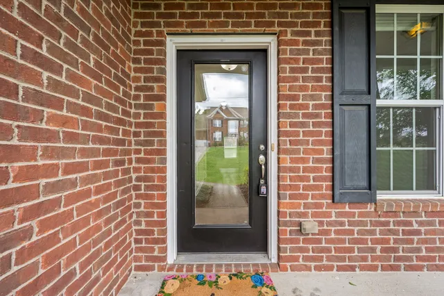 a view of a brick house with a door