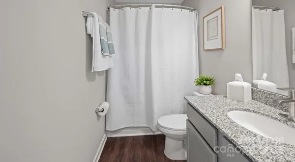 a kitchen with appliances a sink and cabinets