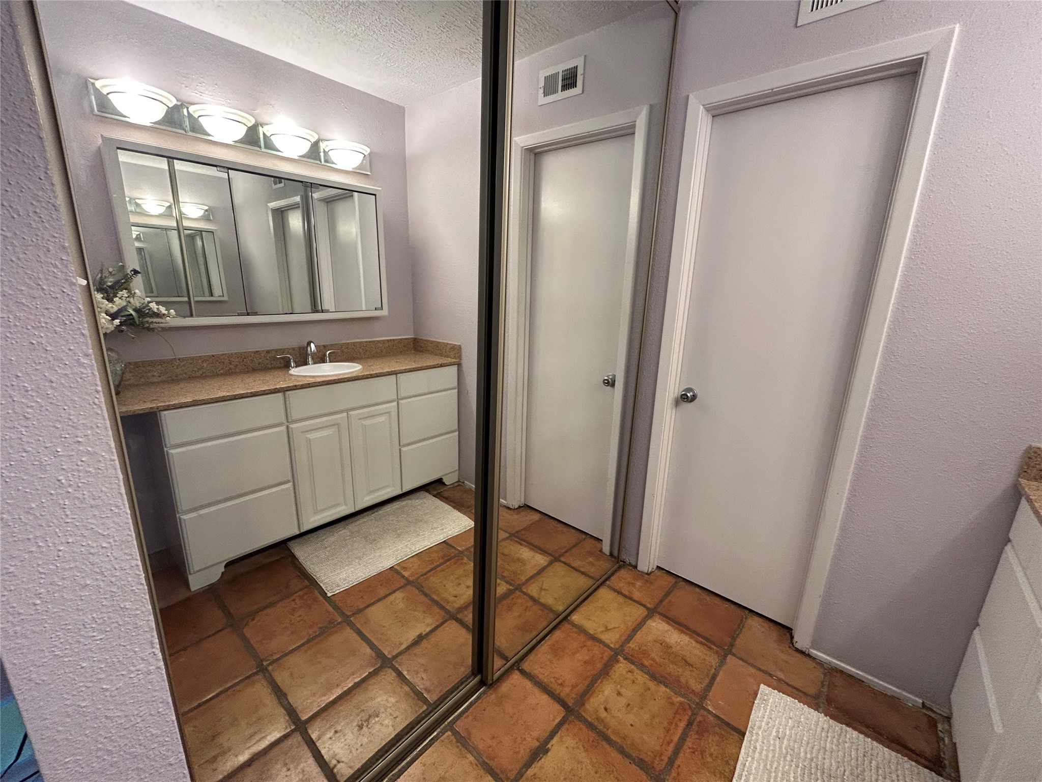 13034 Leader Street, Unit 965 Houston, TX 77072 - Photo 21 of 32 Downstairs vanity as reflected in mirrored closet doors.
