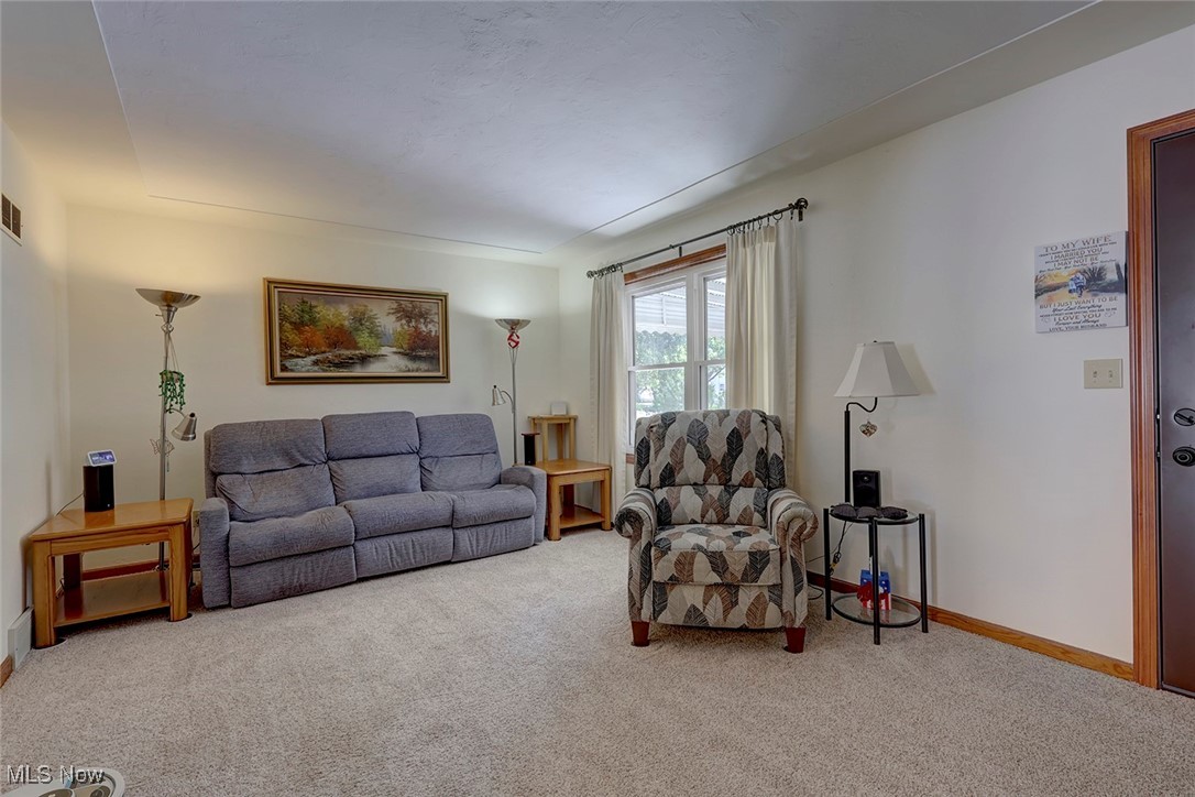 1525 Root Road Lorain, OH 44052 - Photo 15 of 41 Living room featuring carpet flooring