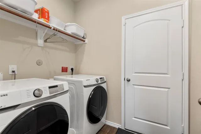 a utility room with dryer and washer
