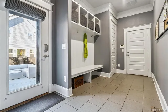 a kitchen with stainless steel appliances granite countertop a stove and a view of living room