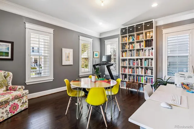a bathroom with a sink a toilet and a large mirror
