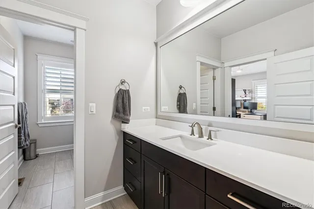a view of a livingroom with furniture and a window