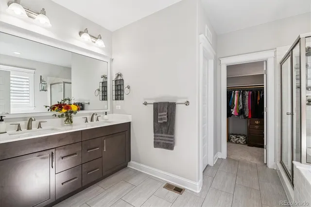 a kitchen with stainless steel appliances kitchen island granite countertop a refrigerator and a stove top oven