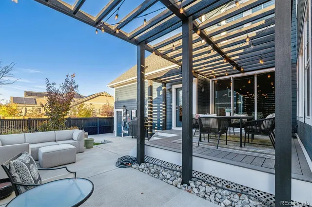 a view of a house with backyard and porch