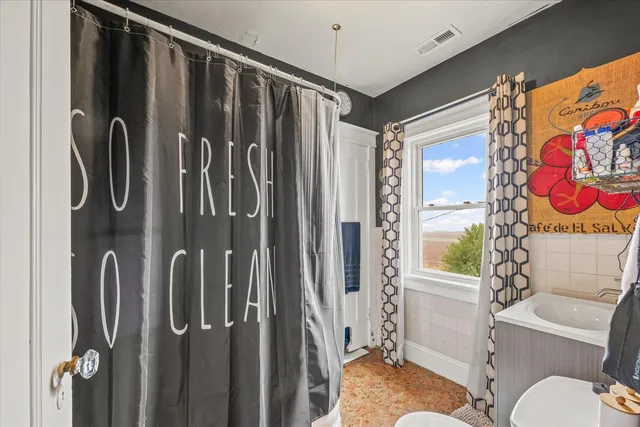 a bathroom with a shower curtain