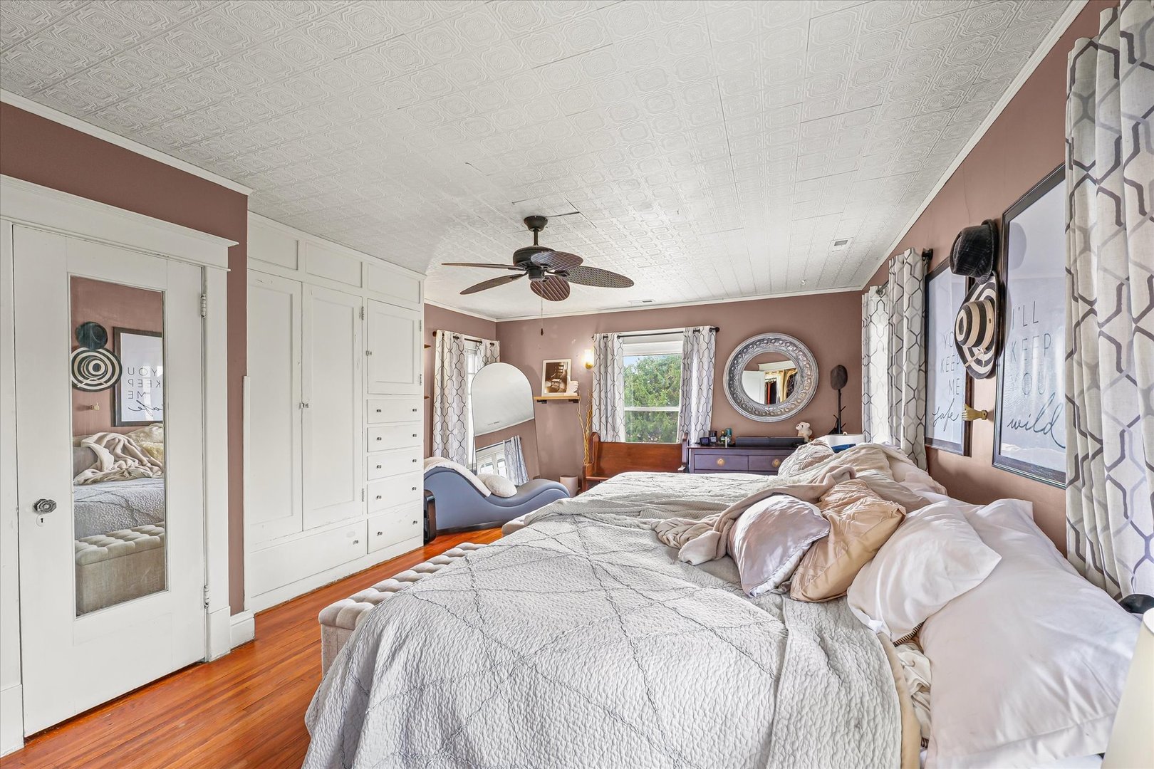 37857 East 100 North Road Bellflower, IL 61724 - Photo 27 of 43 a bedroom with a bed and a chandelier