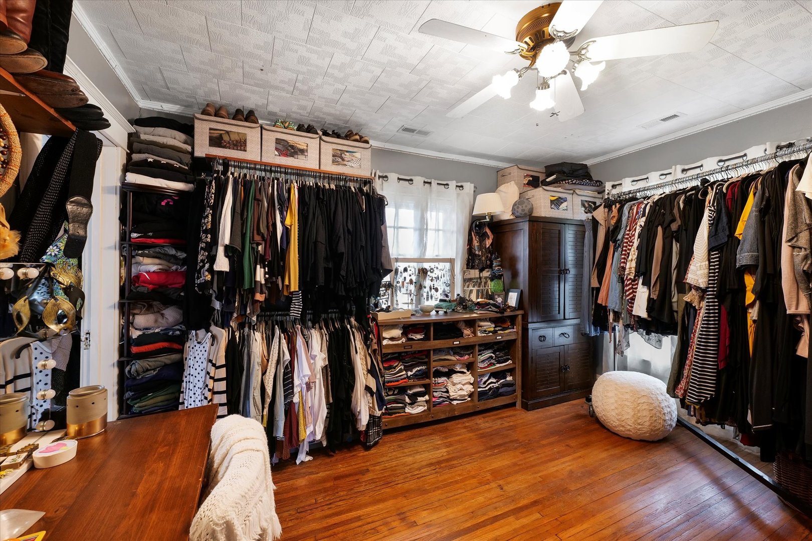 37857 East 100 North Road Bellflower, IL 61724 - Photo 29 of 43 a view of walk in closet with clothes and shoes