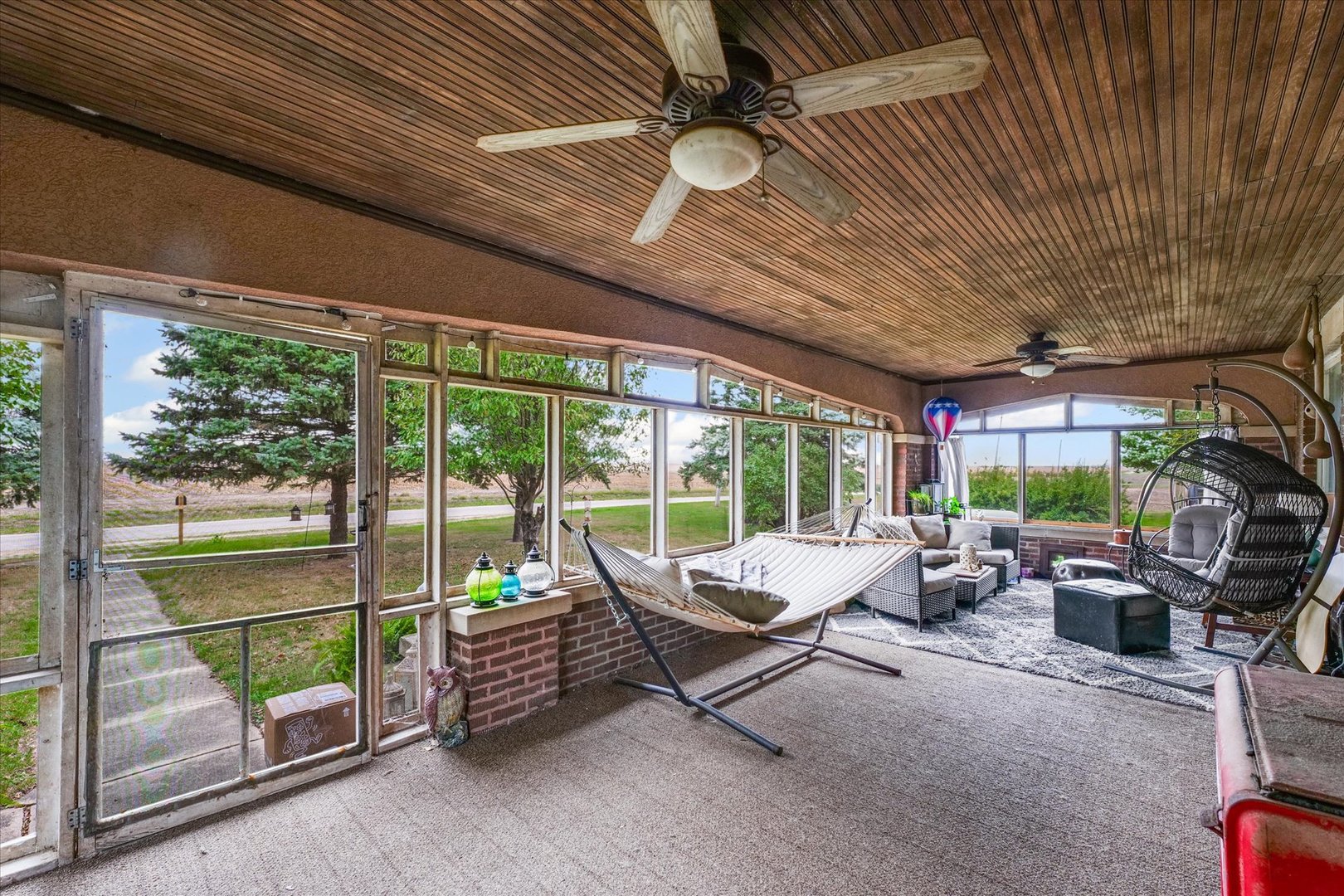 37857 East 100 North Road Bellflower, IL 61724 - Photo 4 of 43 a living room with furniture and a floor to ceiling window