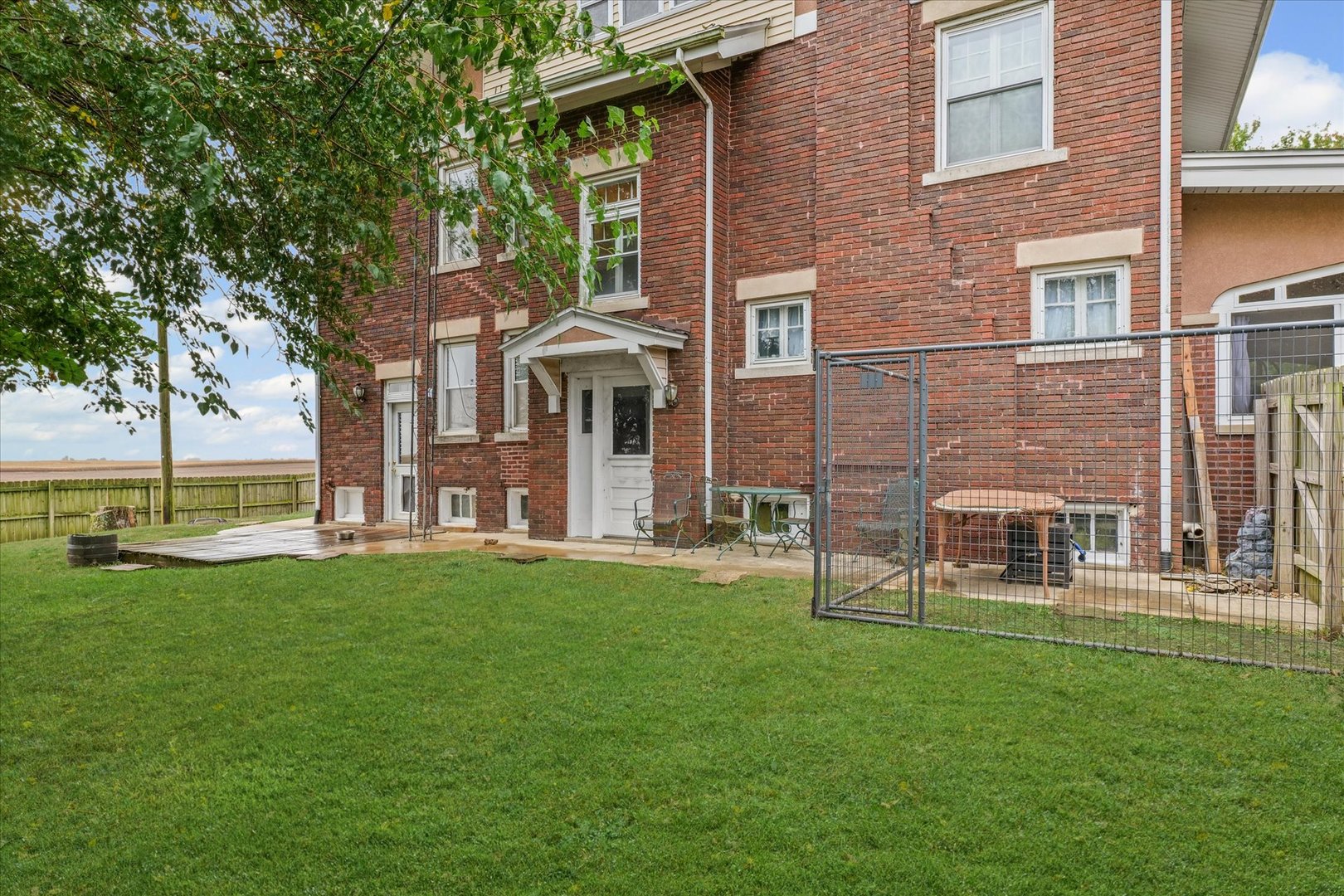 37857 East 100 North Road Bellflower, IL 61724 - Photo 41 of 43 front view of a brick building with a yard