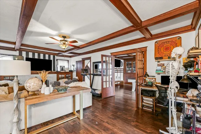 a view of a livingroom with furniture wooden floor and chandelier