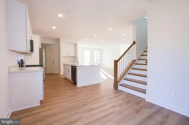 a bathroom with a toilet a sink and a window