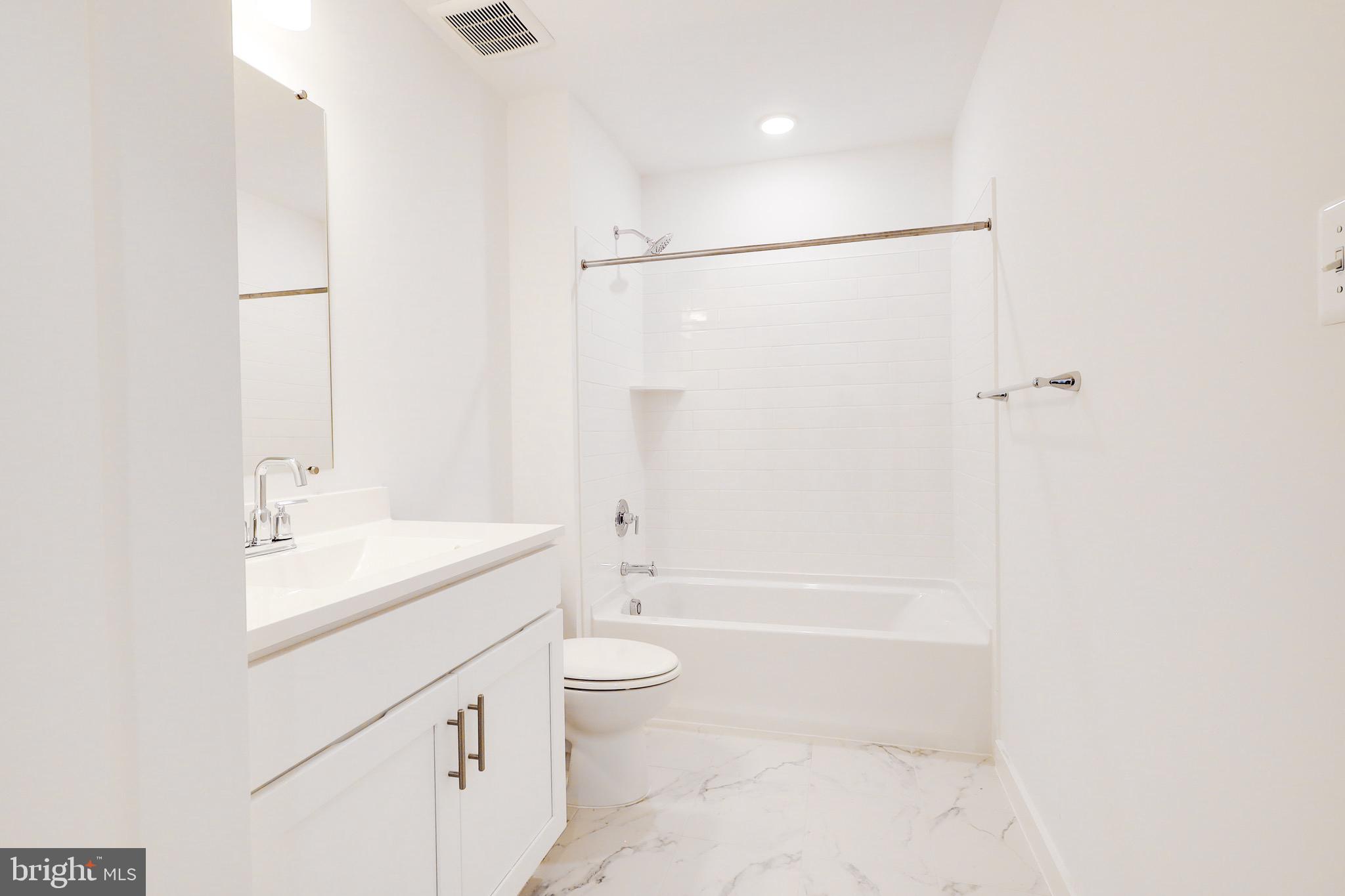 14 Stouffer Avenue Boonsboro, MD 21713 - Photo 31 of 40 a bathroom with a sink a toilet and shower