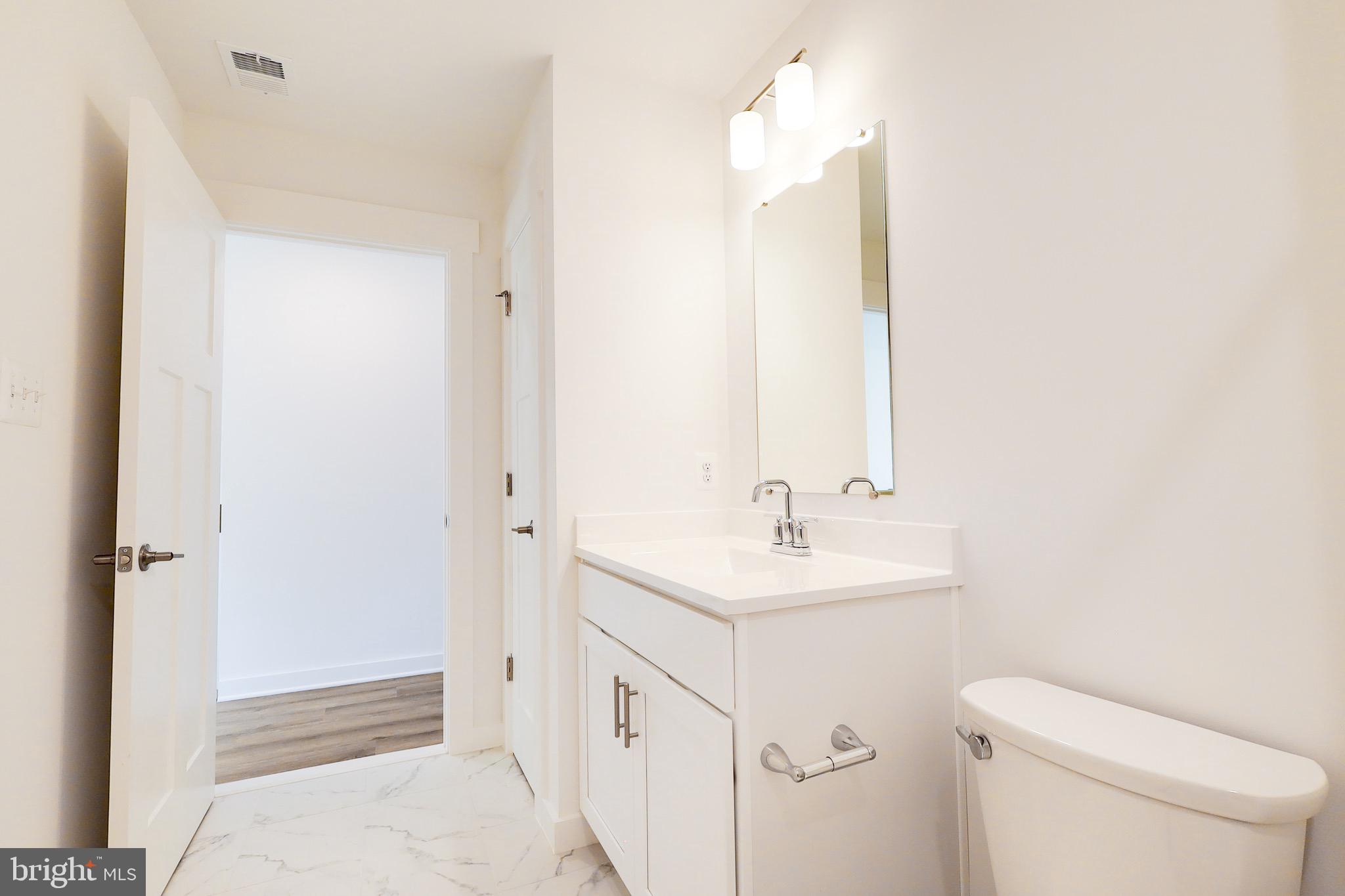 14 Stouffer Avenue Boonsboro, MD 21713 - Photo 32 of 40 a bathroom with a sink a toilet and shower
