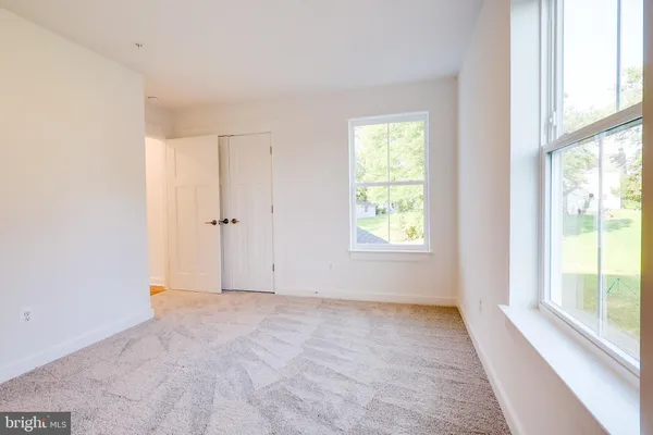 a view of an empty room with stairs