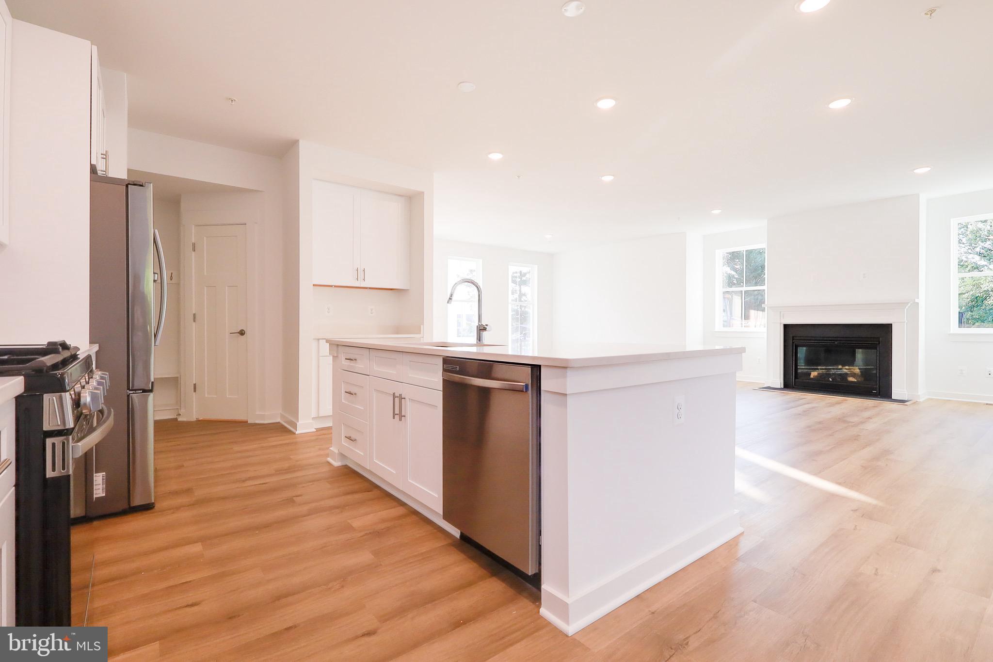 14 Stouffer Avenue Boonsboro, MD 21713 - Photo 9 of 40 a kitchen with stainless steel appliances a stove top oven a sink and a refrigerator