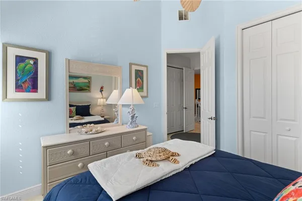 a bed room with a bed and a window