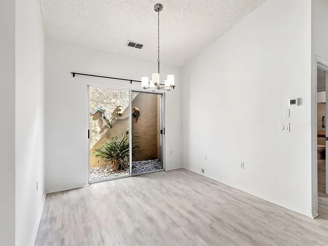 a view of a chandelier and closet in a room