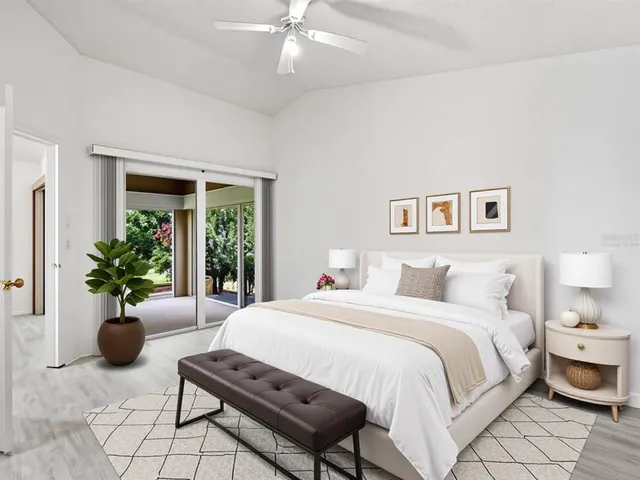 a bedroom with a bed and a table