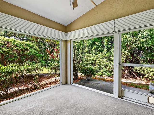 a view of a room with a large window and an outdoor view
