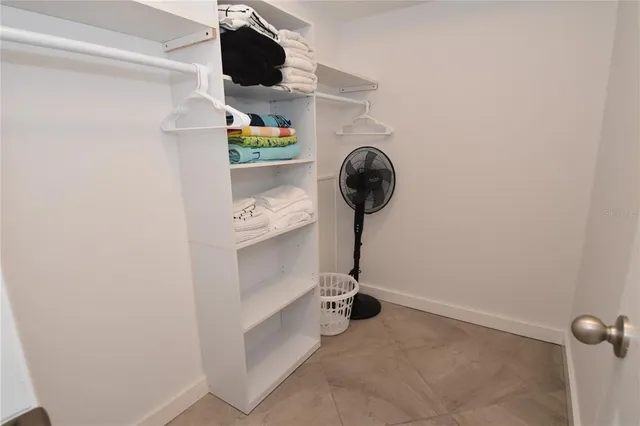 a view of storage and utility room with a fireplace