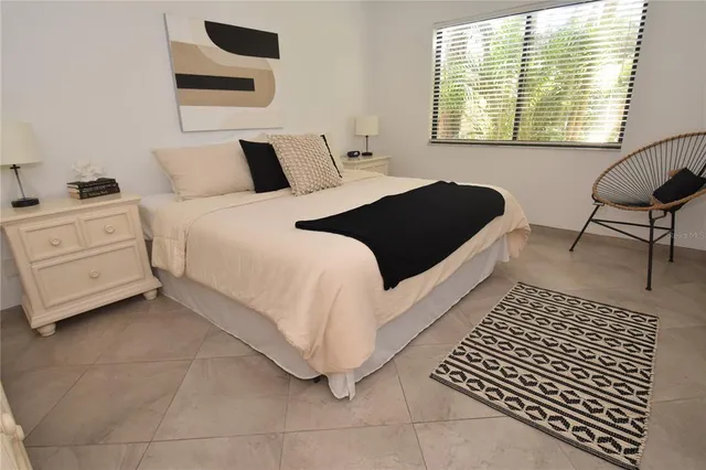 a bedroom with a bed and a table