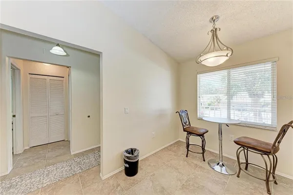 a view of a room with windows and lounge chair