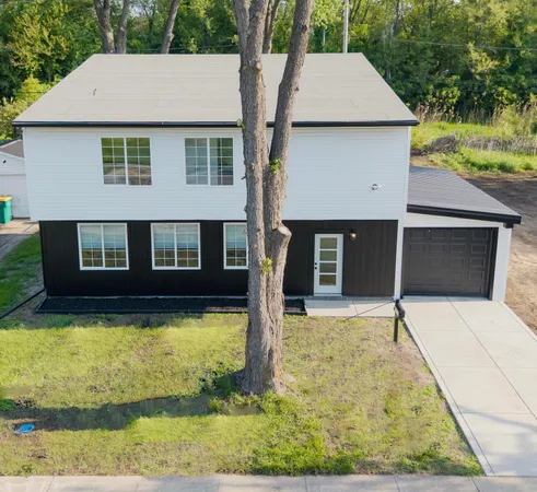 a house with trees in the background