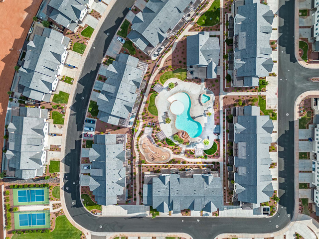 2600 Ocotillo Way, Unit 31 Santa Clara, UT 84765 - Photo 61 of 73 Community amenities featuring a resort-style pool with a separate hot tub, surrounding lounge areas, and a children's play structure
