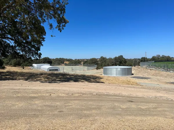 a view of a road with a building in the background