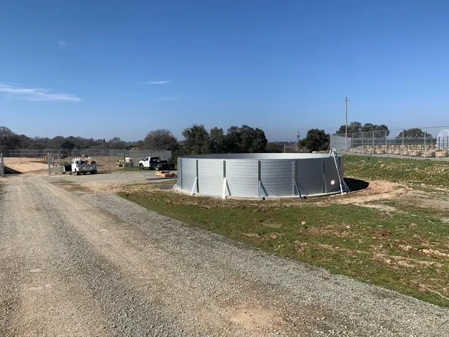 a view of a field with a mountain in the background