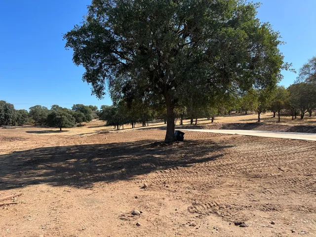 a kitchen with a refrigerator and a table
